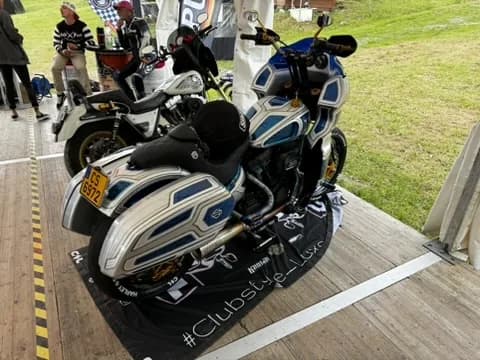 Row of custom baggers under the Clubstyle event tent in the Alps