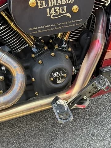 Close-up of a custom El Diablo 143ci Harley motor with gold hardware
